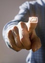 Right hand of a mature caucasian man pressing a virtual Off button Royalty Free Stock Photo