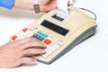 Hand presses cash register keys another takes out check Royalty Free Stock Photo