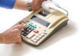 Hand presses cash register keys another takes out check Royalty Free Stock Photo