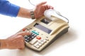 Hand presses cash register keys another takes out check Royalty Free Stock Photo