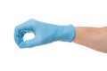 Right hand wearing latex surgical glove with gesture number zero on wite background