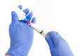 Right Handed Anesthesiologist Withdrawing Propofol into a Syringe