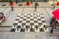 People around one of the four giant chess sets in the Quartier des spectacles in Montreal
