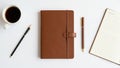 Right is an open lined notepad and a matching brown pen with gold Royalty Free Stock Photo