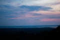 Beautiful silhouette of tree branches against the sky at sunset makes the sky is blue, orange Royalty Free Stock Photo