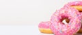 Right pink yummy donuts banner. Close up.