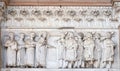 The right portal of the Cathedral of St Martin in Lucca. Lunette dedicated to the life of St Regulus, Lucca, Italy. Royalty Free Stock Photo