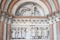 The right portal of the Cathedral of St Martin in Lucca. Lunette dedicated to the life of St Regulus, Lucca, Italy Royalty Free Stock Photo