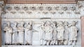 The right portal of the Cathedral of St Martin in Lucca. Lunette dedicated to the life of Saint Regulus, Italy. Royalty Free Stock Photo