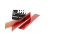 Right side Film stripes with clapperboard and negative on white background Royalty Free Stock Photo