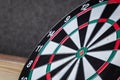 Right on target concept using dart in the bullseye on dartboard Royalty Free Stock Photo