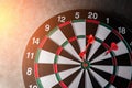 Right on target concept using dart in the bullseye on dartboard Royalty Free Stock Photo