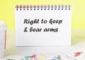 right to keep and bear arms text written on a piece of paper of a notebook standing on the table Royalty Free Stock Photo