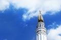 The right tower (minaret) of the mosque in a sunny day against the blue sky