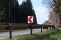 Right Turn Sign: Road signs warn of a sharp turn on a narrow road