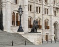 Right of two Bronze lion statues flanking the East entrance of the Hungarian Parliament Building, Budapest