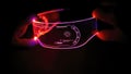 Right view of eyeware goggles colorful neon light, futuristic digital innovation concept, glow in dark background, cyber device, Royalty Free Stock Photo