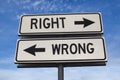 Right vs wrong. White two street signs with arrow on metal pole with word Royalty Free Stock Photo