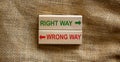 Right way vs wrong way, improvement and change management business concept. Wooden blocks on beautiful canvas background