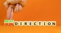 Right or wrong direction symbol. Concept words Right direction Wrong direction on wooden blocks. Beautiful orange background.