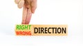 Right or wrong direction symbol. Concept words Right direction Wrong direction on wooden blocks. Beautiful white background.