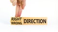 Right or wrong direction symbol. Concept words Right direction Wrong direction on wooden blocks. Beautiful white background.