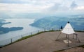 Rigi mount summit view with sign indicating the highest point of the mountain and lake Zug and city aerial view in Swiss Alps