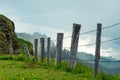 Rigi, Switzerland: View along a fence down to lake lucerne through the fog