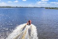 Rigid inflatable boat speeding on water of dutch lake