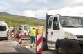 Road works. Renovation on highway. Road machinery at construction site. Signs and signaling. Royalty Free Stock Photo