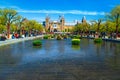 Rijksmuseum in Amsterdam with pond and tulips decoration, Netherlands, Europe