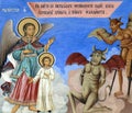 Fresco of guardian angel protecting against the temptations of demons