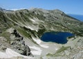 Rila mountains in Bulgaria, deep blue lakes and gray rock summit during the sunny day with clear blue sky Royalty Free Stock Photo