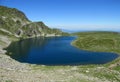 Rila mountains in Bulgaria, deep blue lakes and gray rock summit during the sunny day with clear blue sky Royalty Free Stock Photo