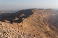 Rim of desert canyon at sunset Royalty Free Stock Photo