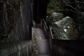 Rim Rock Trail State Park narrow stairway into dark narrow passage Royalty Free Stock Photo