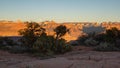 The rim of Smith`s mesa in Southern Utah is in shadow while the last light of day shines on the mountains of Zion national park Royalty Free Stock Photo