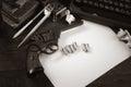 ÃÂ¡rime fiction story - old retro vintage typewriter and revolver gun with ammunitions, books, blank paper, old ink pen. Sepia tone Royalty Free Stock Photo