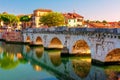 Rimini cityscape. Famous Bridge of Tiberius in Rimini, Italy. Ancient landmark Ponte di Tiberio