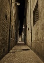 Rimini, Emilia Romagna, Italy: dark narrow alley at night in the old town