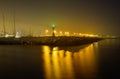 Rimini harbour at night with lighthouse