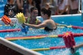 Rimini, Italy - may 2019: Girls Doing Water Aerobics with Floating Pool Dumbbells Outdoor in a Swimming Pool