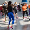 Rimini, Italy - may 2019: People Exercising with Plastic Water Bottle in Class at Gym with Music and Teacher on Stage