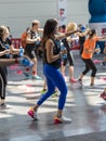 Rimini, Italy - may 2019: People Exercising with Plastic Water Bottle in Class at Gym with Music and Teacher on Stage