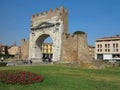 13.06.2017, Rimini, Italy - tourists near Arch of Augustus, ancient romanesque gate of the city
