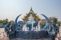 Rimkok district,Chiang Rai Province,Northern Thailand on January 19,2020:The fountain,white Buddha statue and angellic guardians