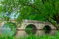 Rimski most or Roman bridge reflecting in the Bosna river