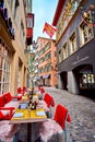 Rindermarkt strteet with cozy outdoor seatings of local restaurants, on April 3 in Zurich, Switzerland