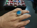 ring with a blue stone clad in pure silver