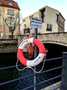 Ring buoy on bridge over Spree river in the winter.